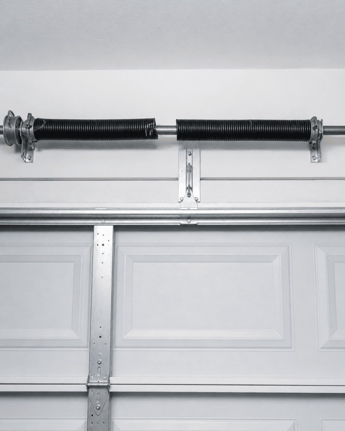 Broken torsion spring above a residential garage door